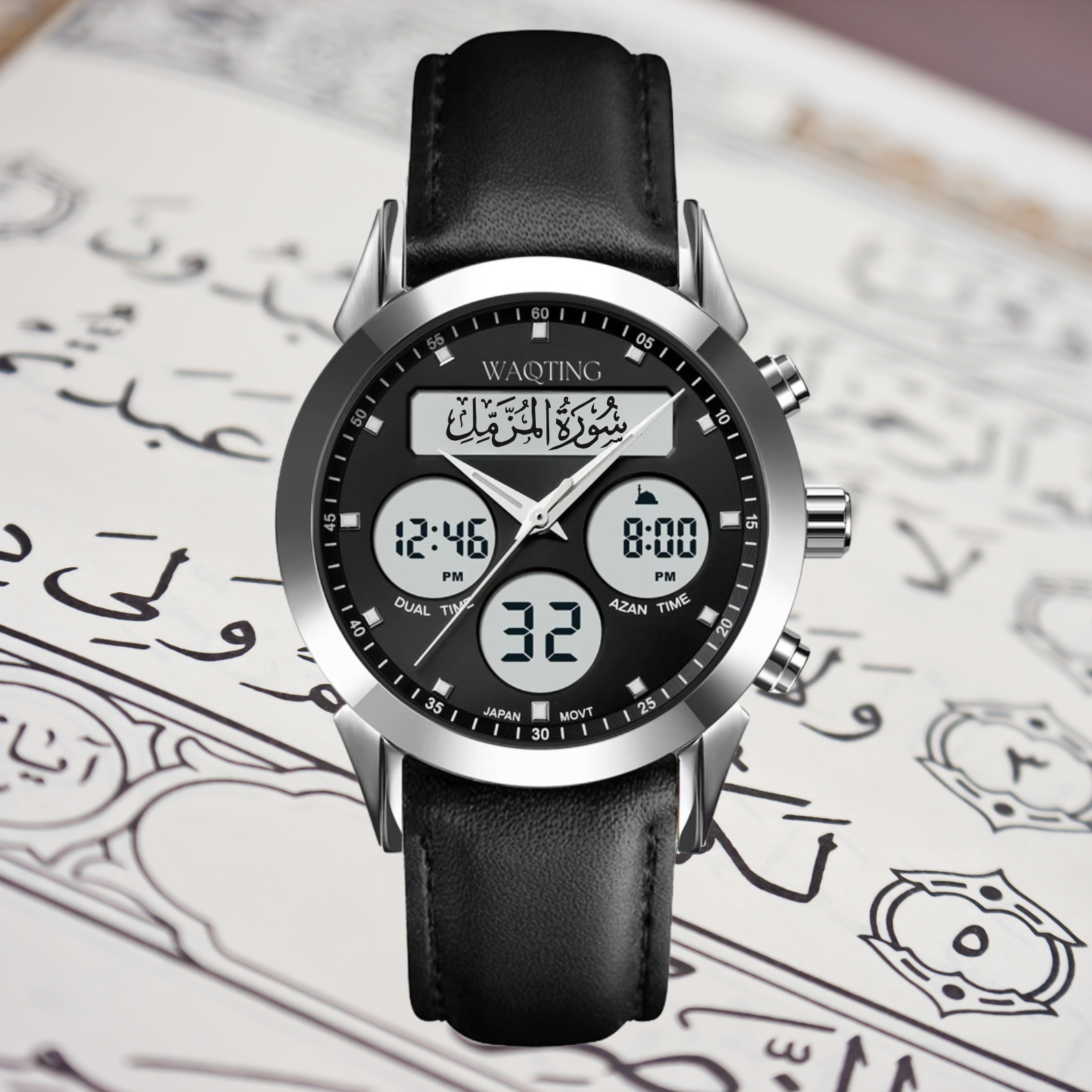 Black wristwatch with digital display on a quranic text background