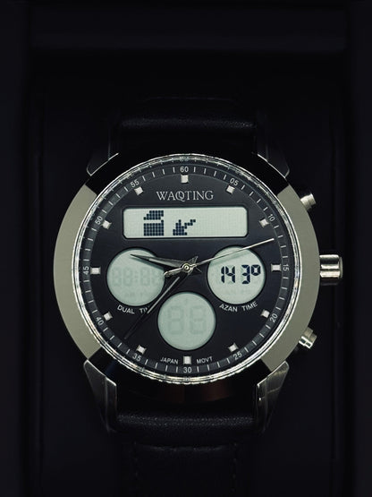 Black digital watch with multiple time zones and features on a dark background