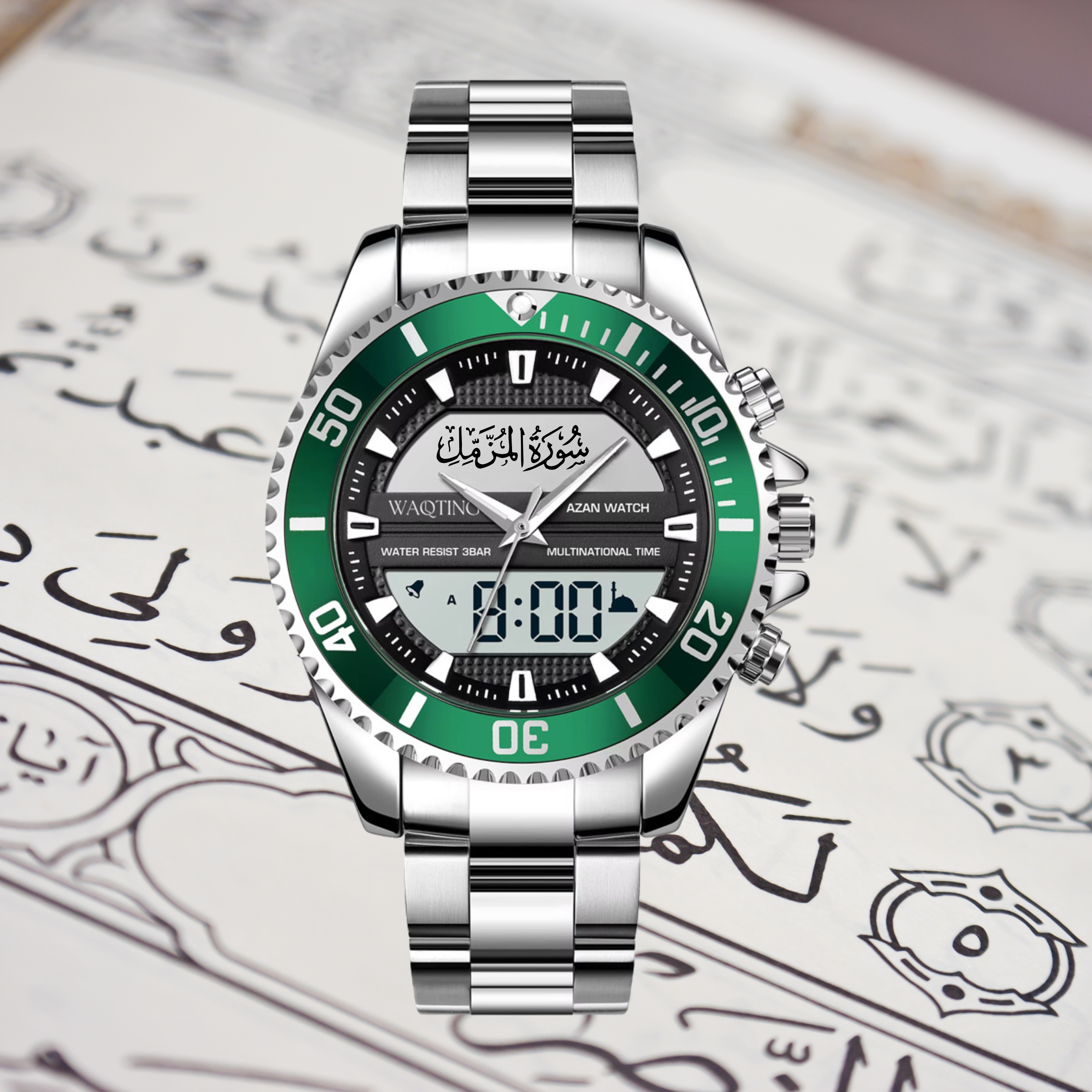 Silver watch with green face on a white background