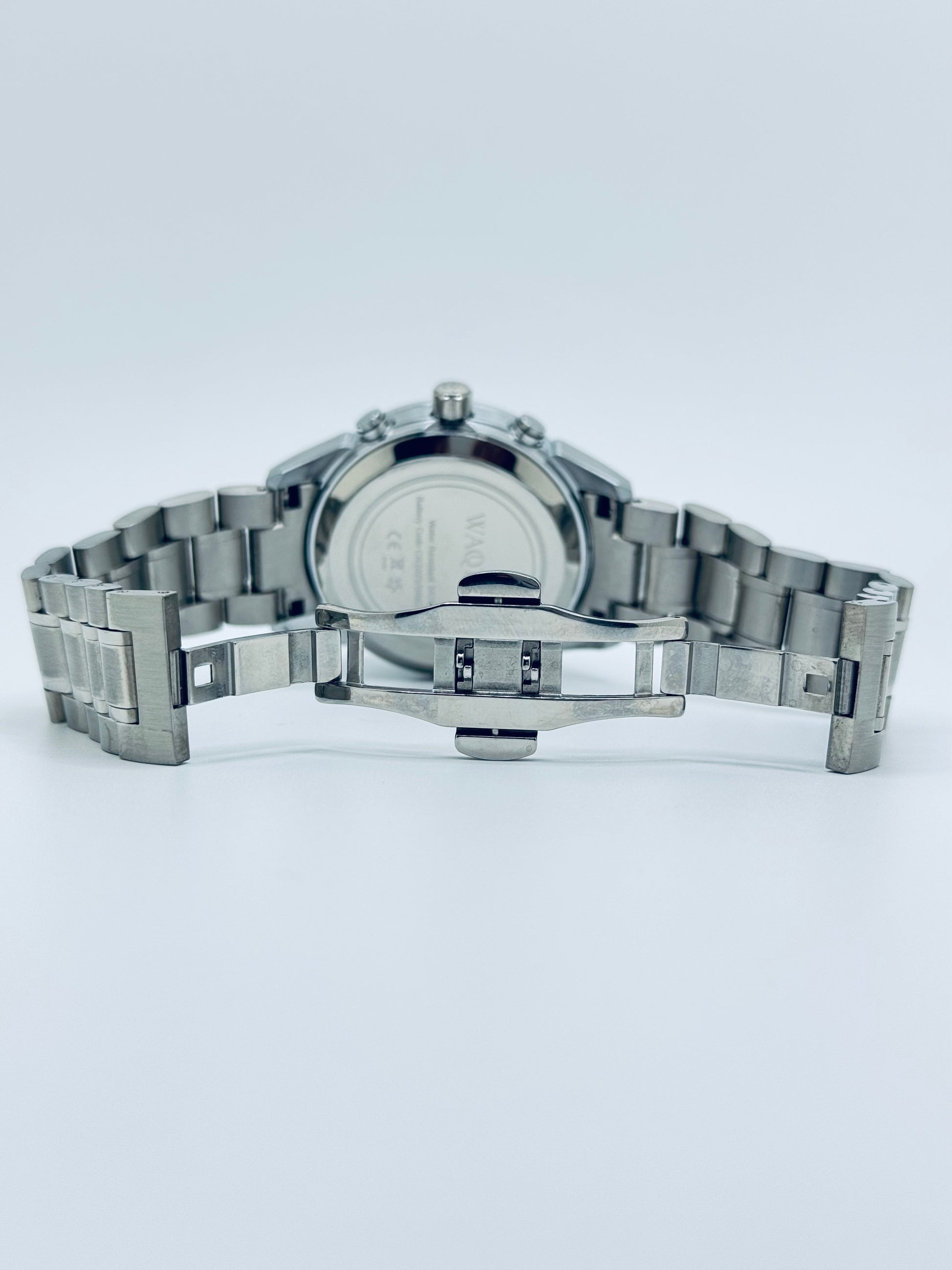 Silver watch with a metal band on a white background