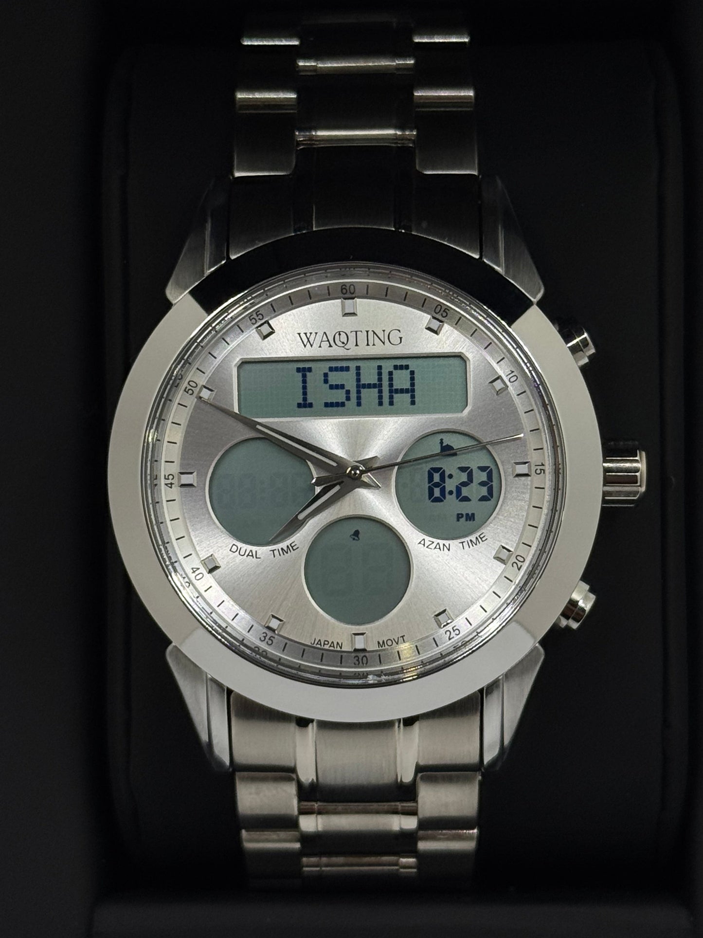 Silver digital watch with 'ISHA' branding on a dark background